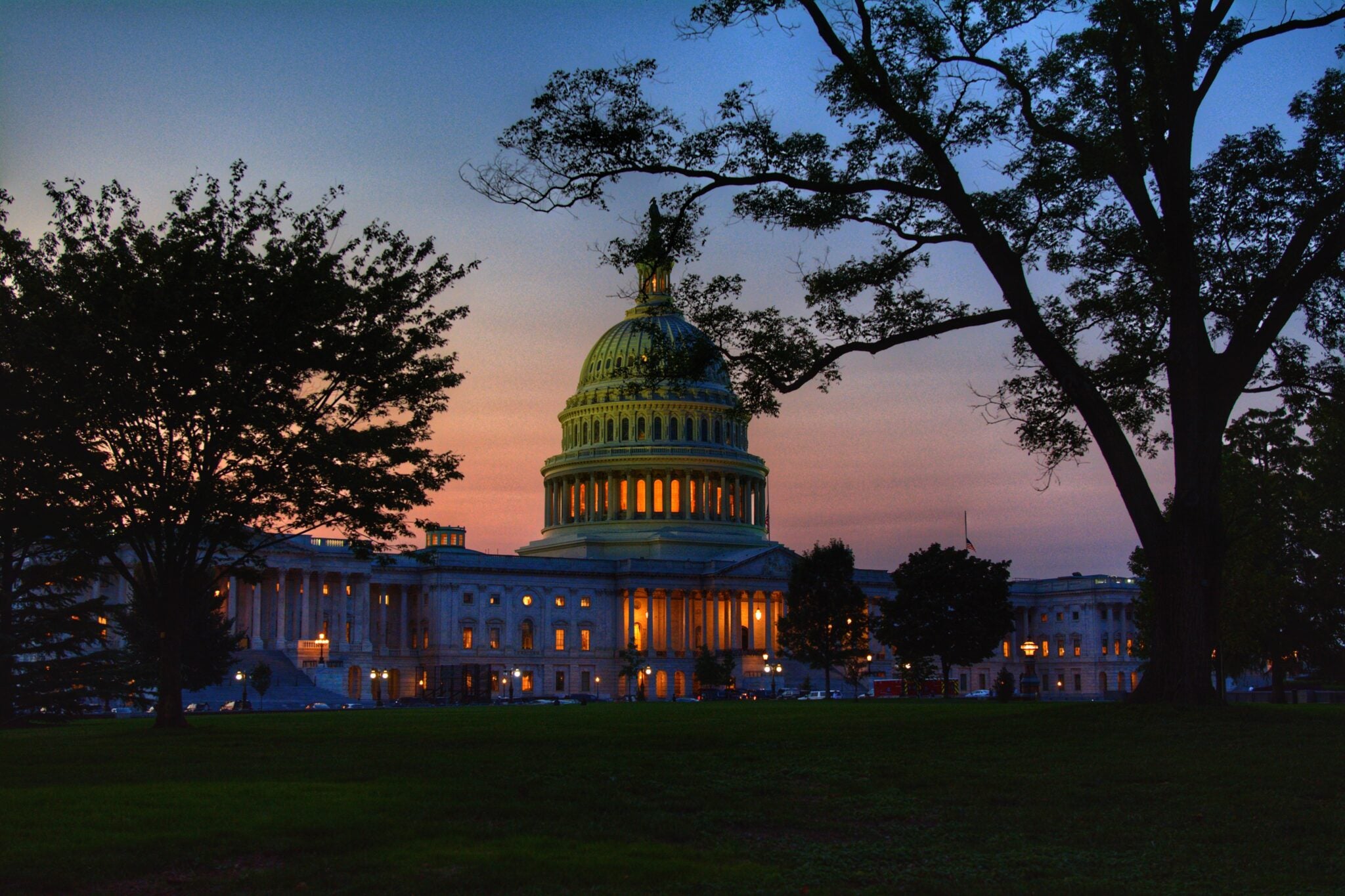 An image of the United States capitol building in Washington D.C. at sunset.
