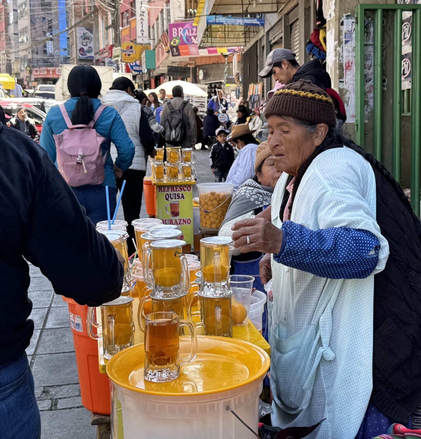 A street vendor during the morning rush in La Paz, Bolivia (Photo Credit Masha Hamilton)