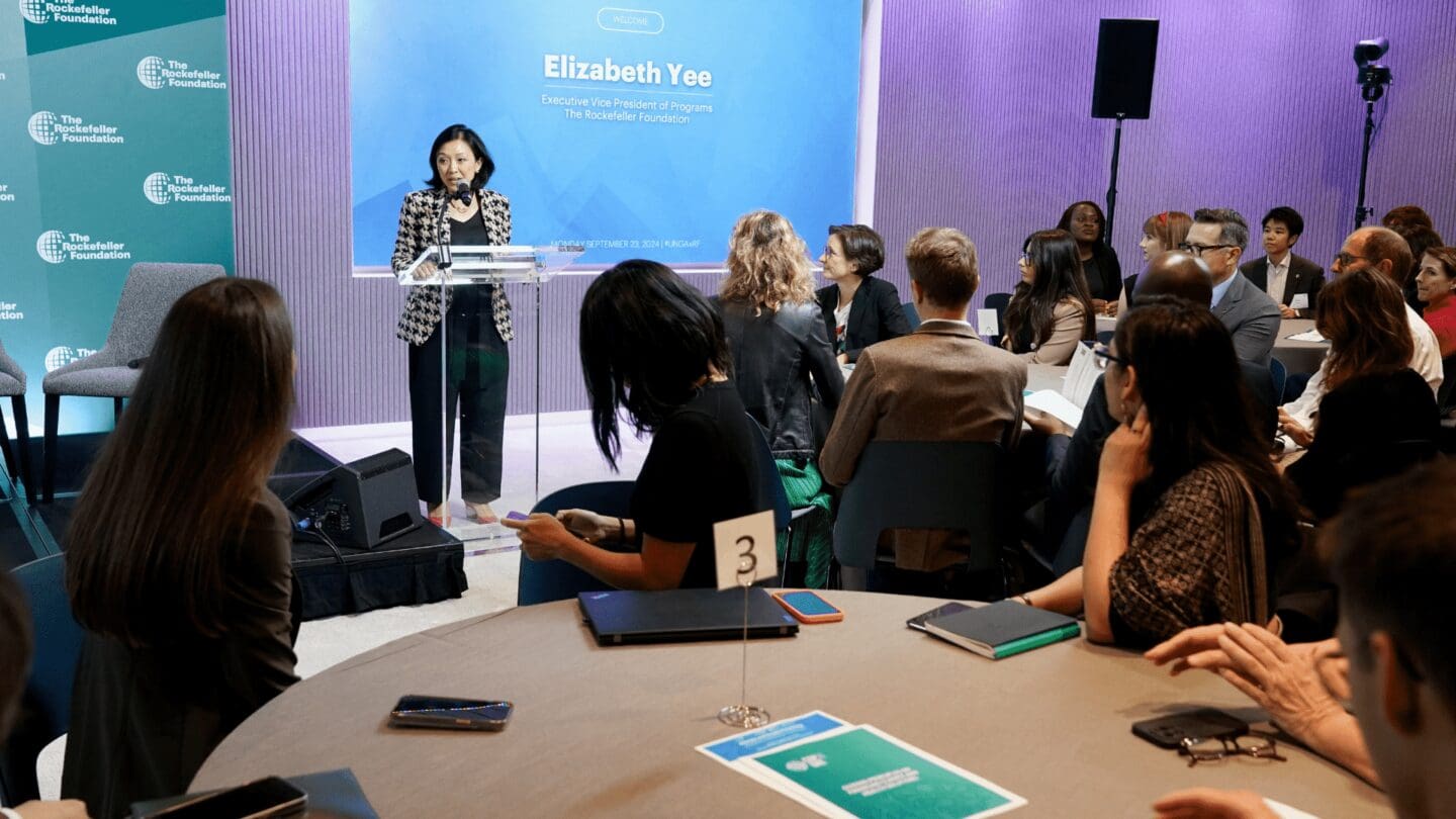 Executive Vice President Elizabeth Yee addresses a gathering at The Rockefeller Foundation headquarters during UNGA's Climate Week