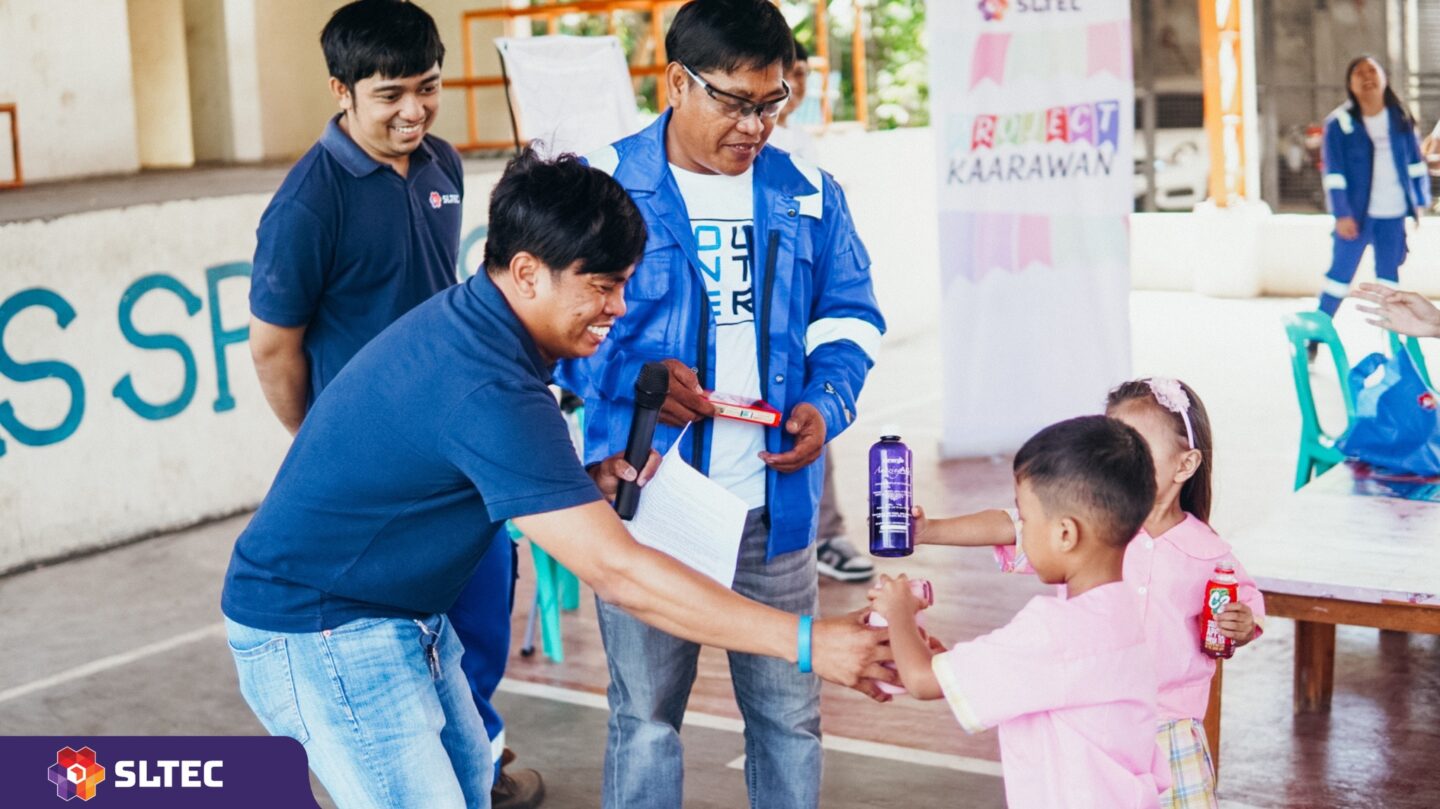 As part of community outreach, employees volunteer for a cause once a month. Here at a local daycare, they teach students how to prepare for natural disasters. (Photo Courtesy of ACEN)