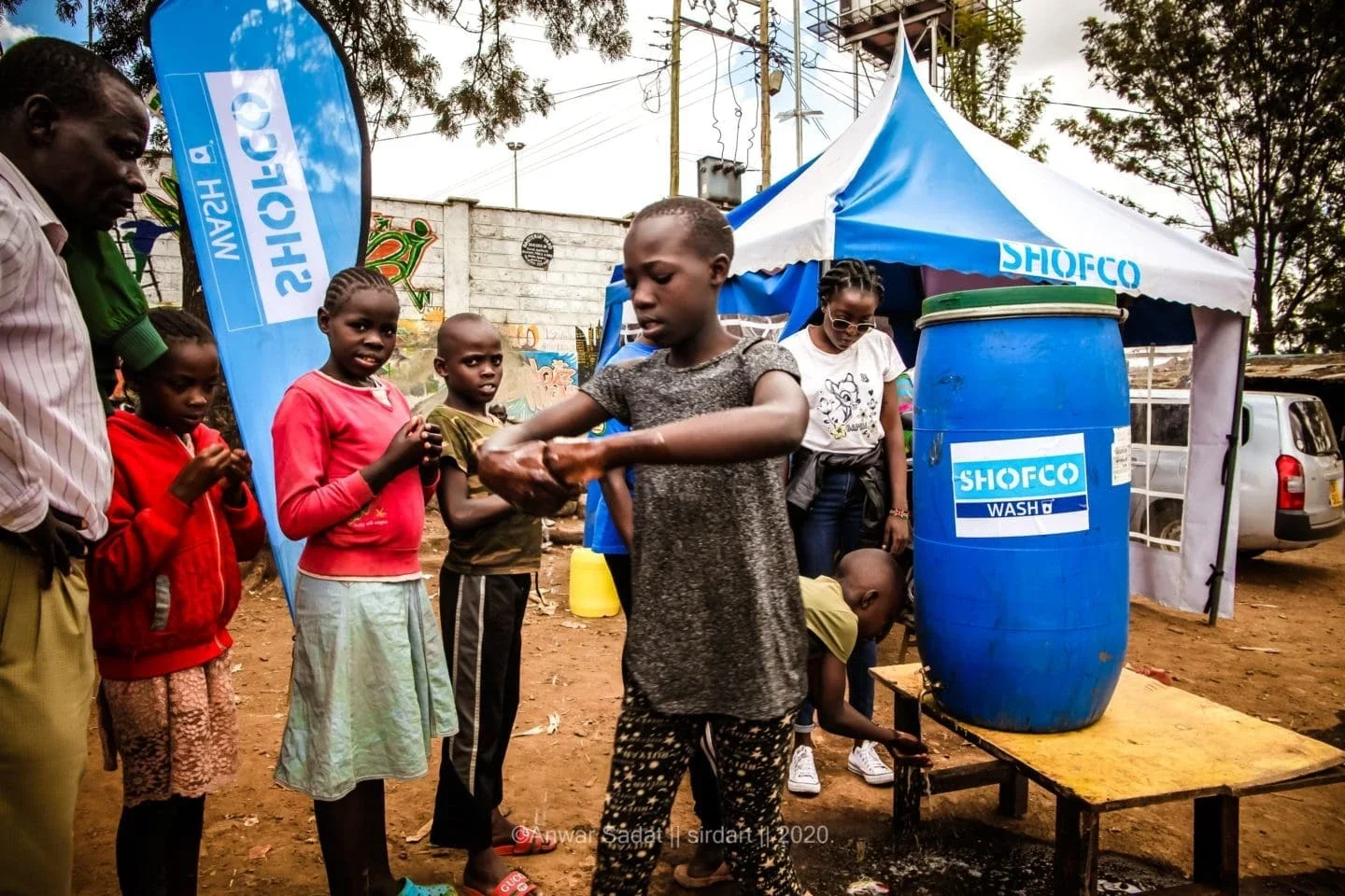 Children washing their hands to halt the spread of Covid-19.