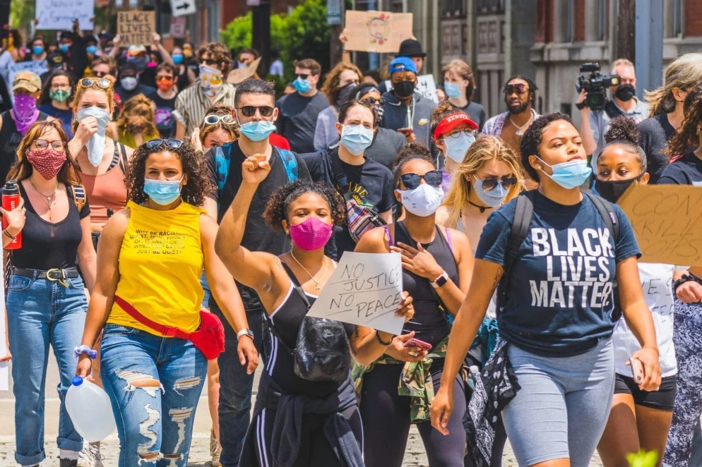 Group of young people on the street protesting.