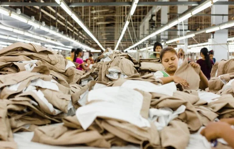 group of women folding fabrics