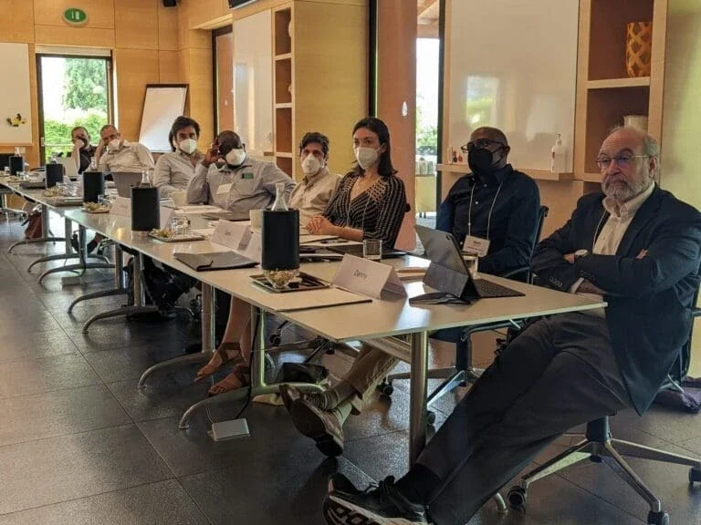 people sitting in chairs at a table