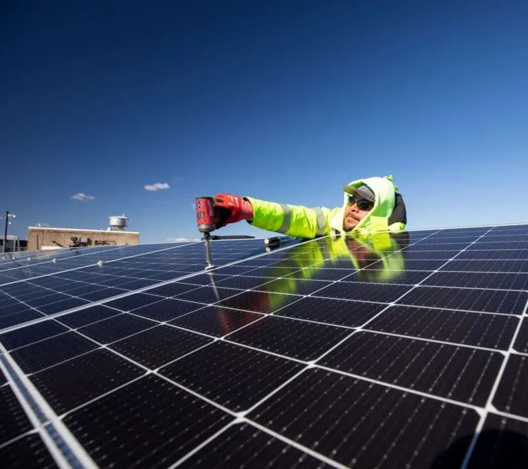 man working on solar panels.