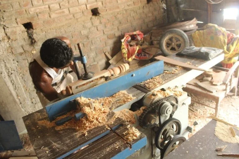 Carpenter in his workshop using electric-powered tools in Bihar in 2015 (Photo Courtesy of SPI)