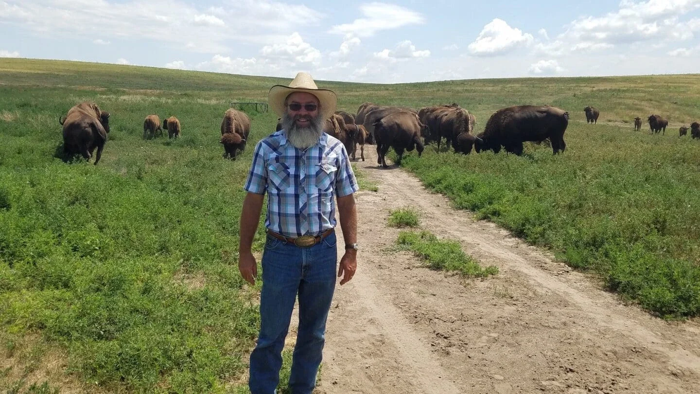 Rex Moore with the Colorado bison he raises (Photo Courtesy of Rex Moore)