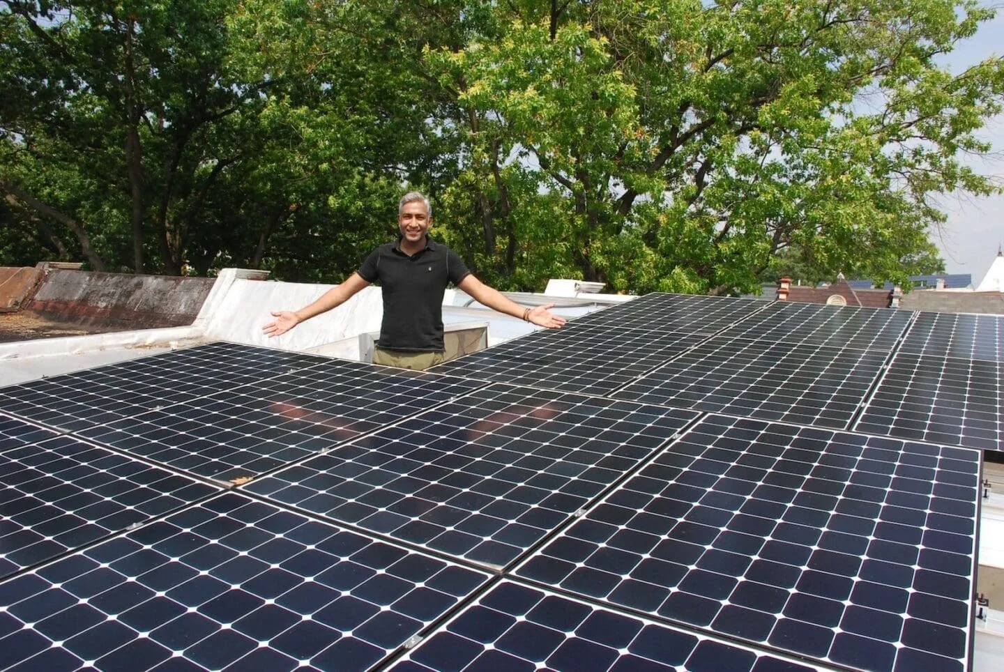 Mt. Pleasant homeowner Gigi Matthews stands next to his newly installed system in 2016 (Photo Courtesy of SUN)