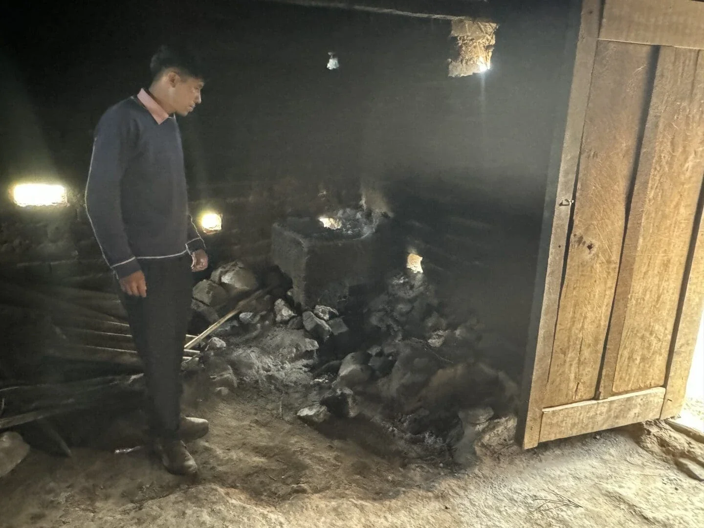 Kewinol School Principal Rodrigo Puyal stands in the school kitchen. He says once they have electricity, a projector is his first priority (Photo Credit Masha Hamilton)