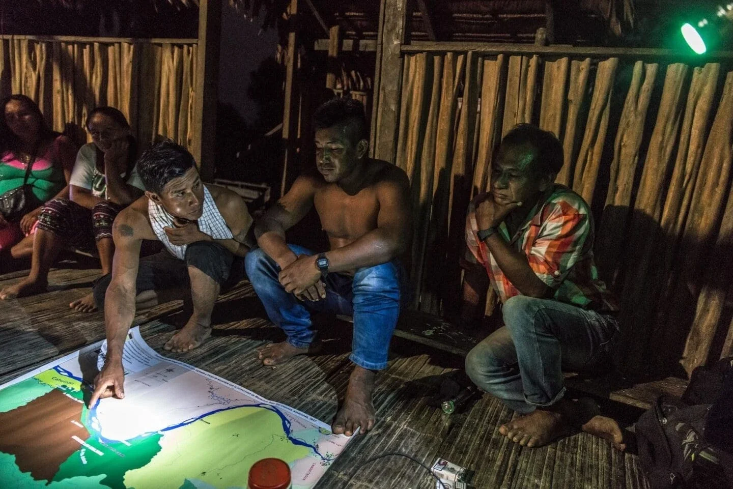 Men of Manacaro help patrol the river to protect the isolated tribes from intrusions in exchange for fishing and hunting rights in established areas. (