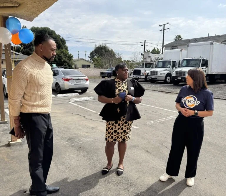 Jacquelyn Badejo (center) speaks to RE-volv's Marques Mason and Ingrid Morales before a Climate Resilience workshop at Calvary Baptist Church in Compton (Photo Credit Masha Hamilton)