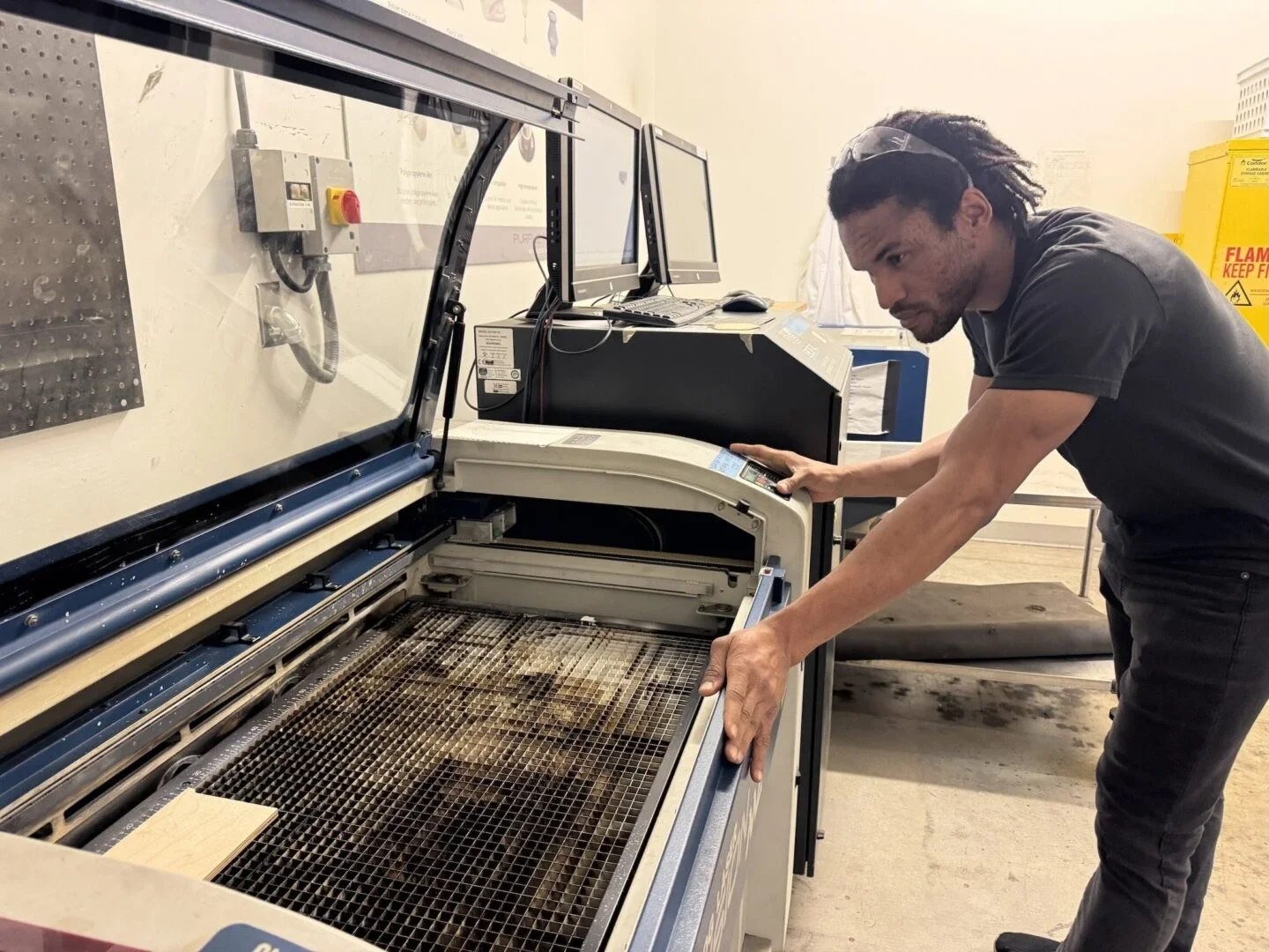 Lauritz David Jr, manager of LACI's Advanced Prototyping Center, testing design files on practice material (Photo Credit Masha Hamilton)